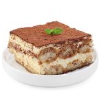 Delicious tiramisu with mint isolated on white